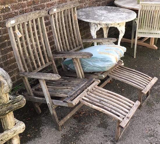 Pair steamer teak garden armchairs with wheels and green cotton covered cushions (weathered condition)
